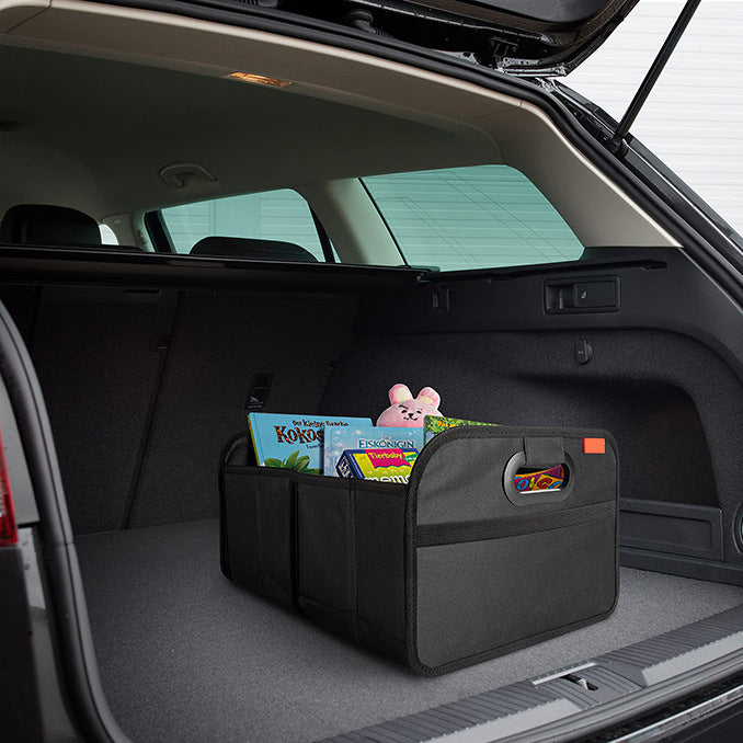 Foldable car trunk organizer holding everyday items in an open car trunk