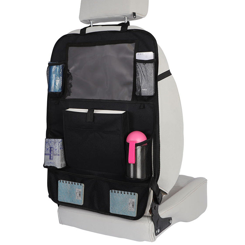 Black car seat back organizer hanging on a seat holding a water bottle, notebooks and wipes; seat and contents not included.