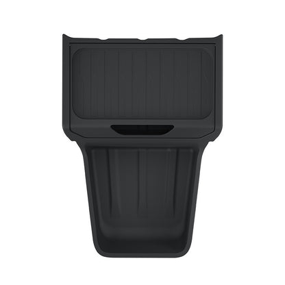 Black center console organizer tray laid flat on a plain white background to show its compartments.