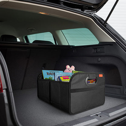 Black fabric car trunk organizer in an open boot holding books and a soft toy; car and contents not included.