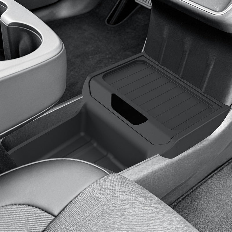 Black center console organizer tray fitted into a car console to keep small items tidy; car interior not included.