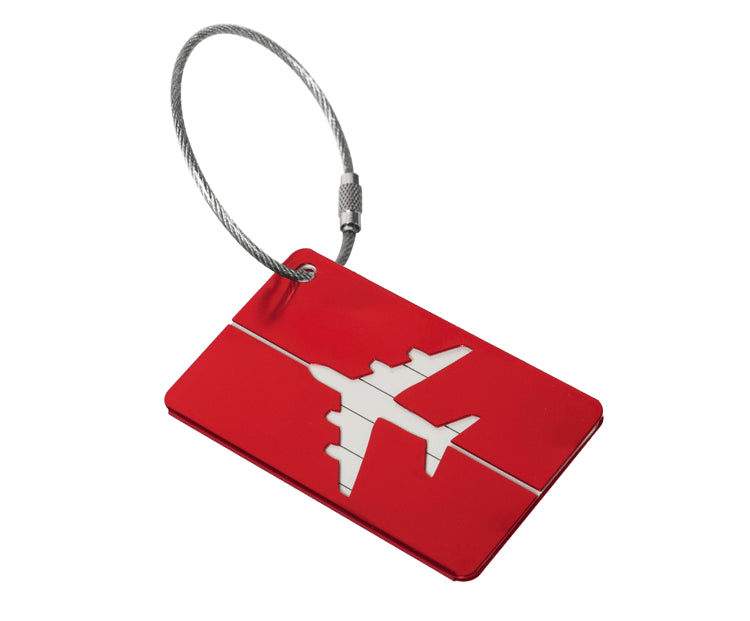 Red metal luggage tag with a wire cable loop shown on a plain white background for attaching to hand luggage.