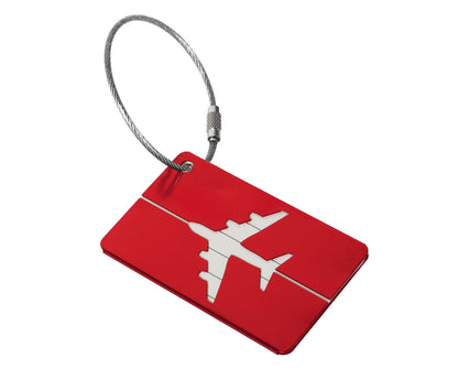 Red metal luggage tag with a wire cable loop shown on a plain white background for attaching to hand luggage.