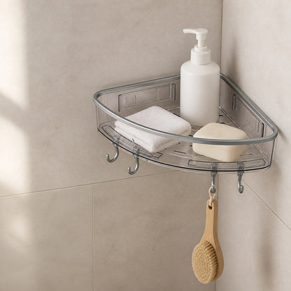 Transparent corner shower shelf holding a blank bottle and face cloth, fitted in a tiled wall corner