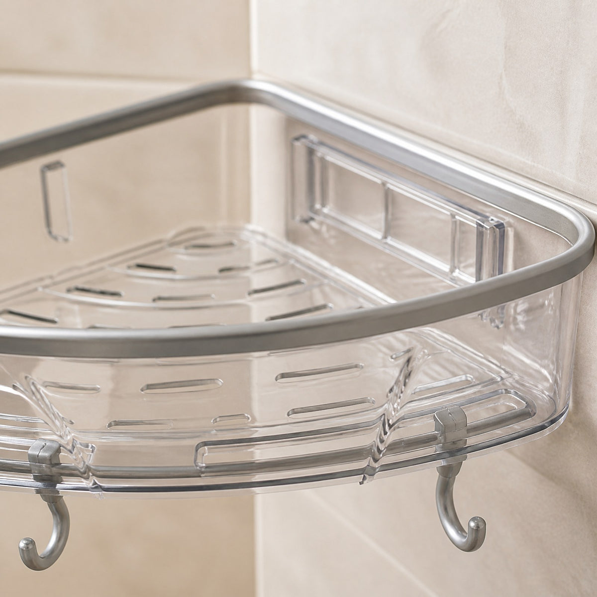 Close-up of the corner shelf's clear tray edge, grey trim, adhesive wall mount and hooks