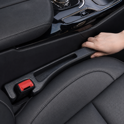 Black Car Seat Gap Filler installed beside the seat belt buckle