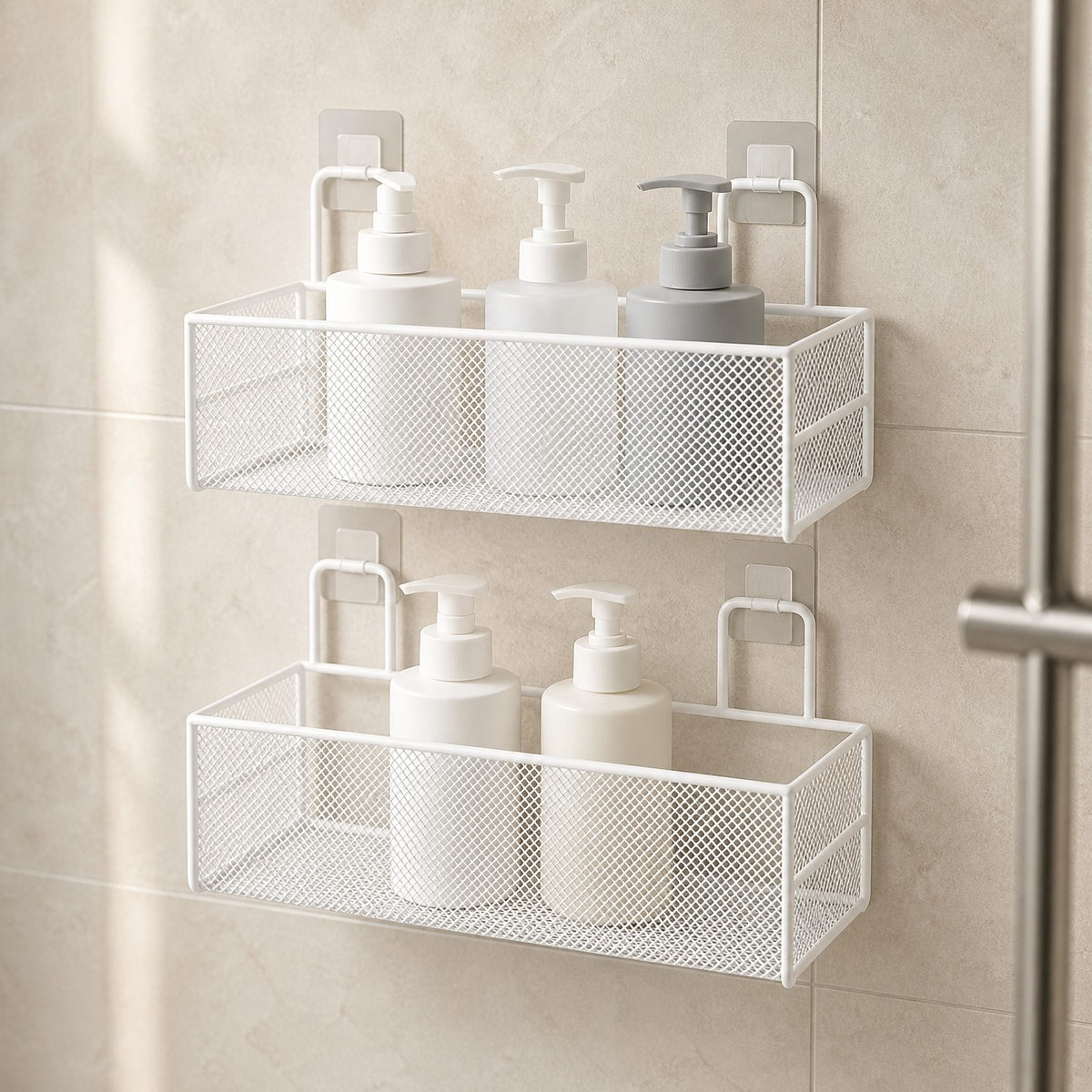 Two-tier white wire mesh shower shelf holding unbranded bottles on a tiled shower wall