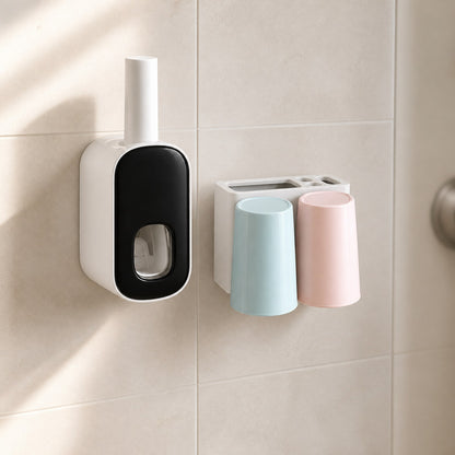 Toothbrush holder with a white housing and glossy black faceplate mounted on a tiled bathroom wall