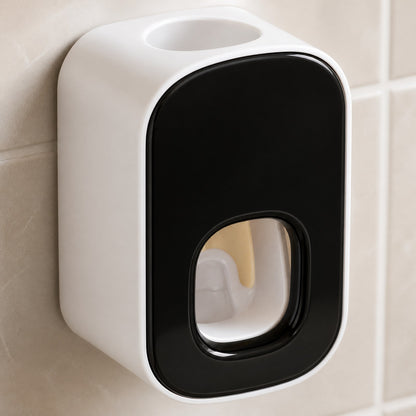 Close-up of the toothpaste dispenser's front opening, internal lever and top tube opening